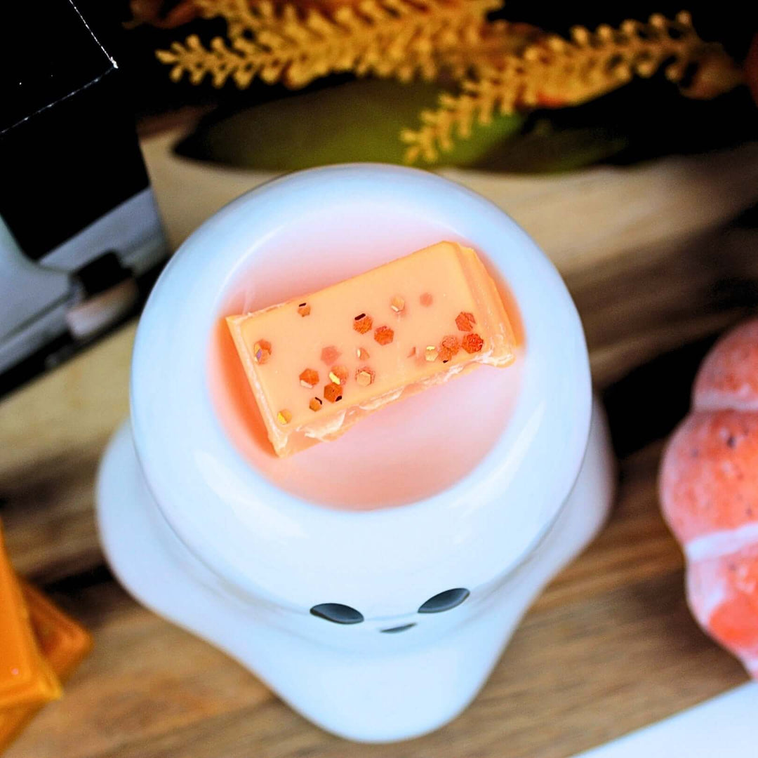 Boo Ghost wax melt and oil burner with melt in dish, styled for Halloween with seasonal accents