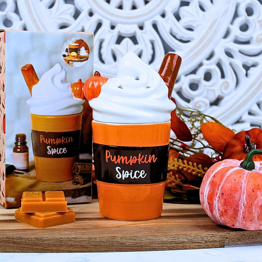 Pumpkin Spice Latte wax melt burner with whipped cream lid off and wax melt inside, styled with autumn décor