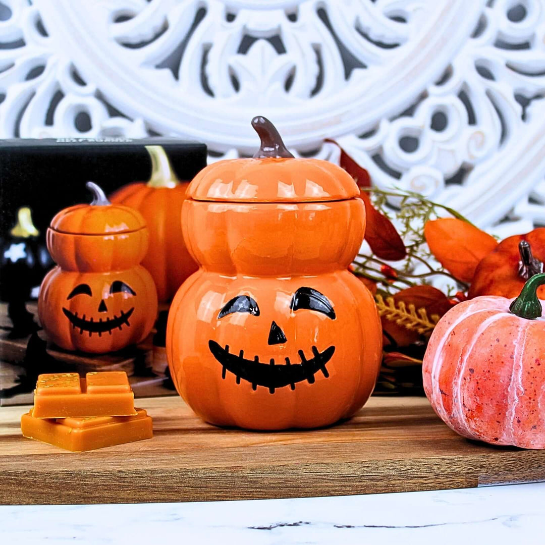 XL orange pumpkin wax melt burner with carved Halloween face, ideal for autumn decor and cosy home vibes