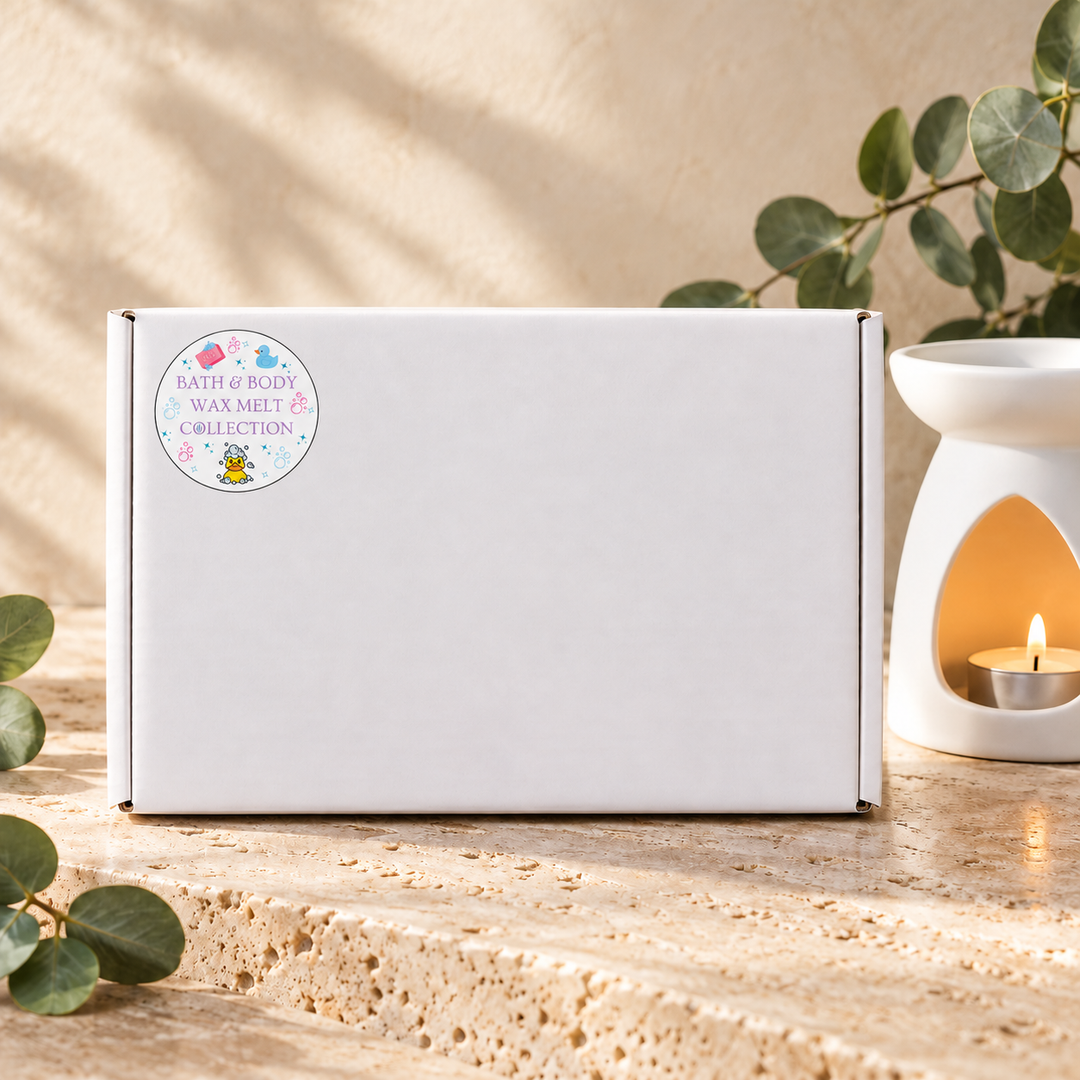Bath &amp; Body Wax Melt Collection white gift box with its collection sticker, beside a white wax burner and eucalyptus leaves, by Smith &amp; Kennedy Scents.