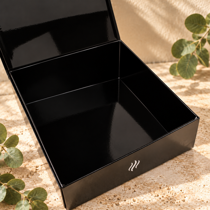 Open Smith &amp; Kennedy Scents black magnetic storage box showing the empty interior and hinged lid.