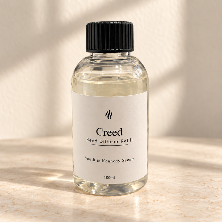 Creed 100ml reed diffuser refill bottle with black screw cap and portrait label