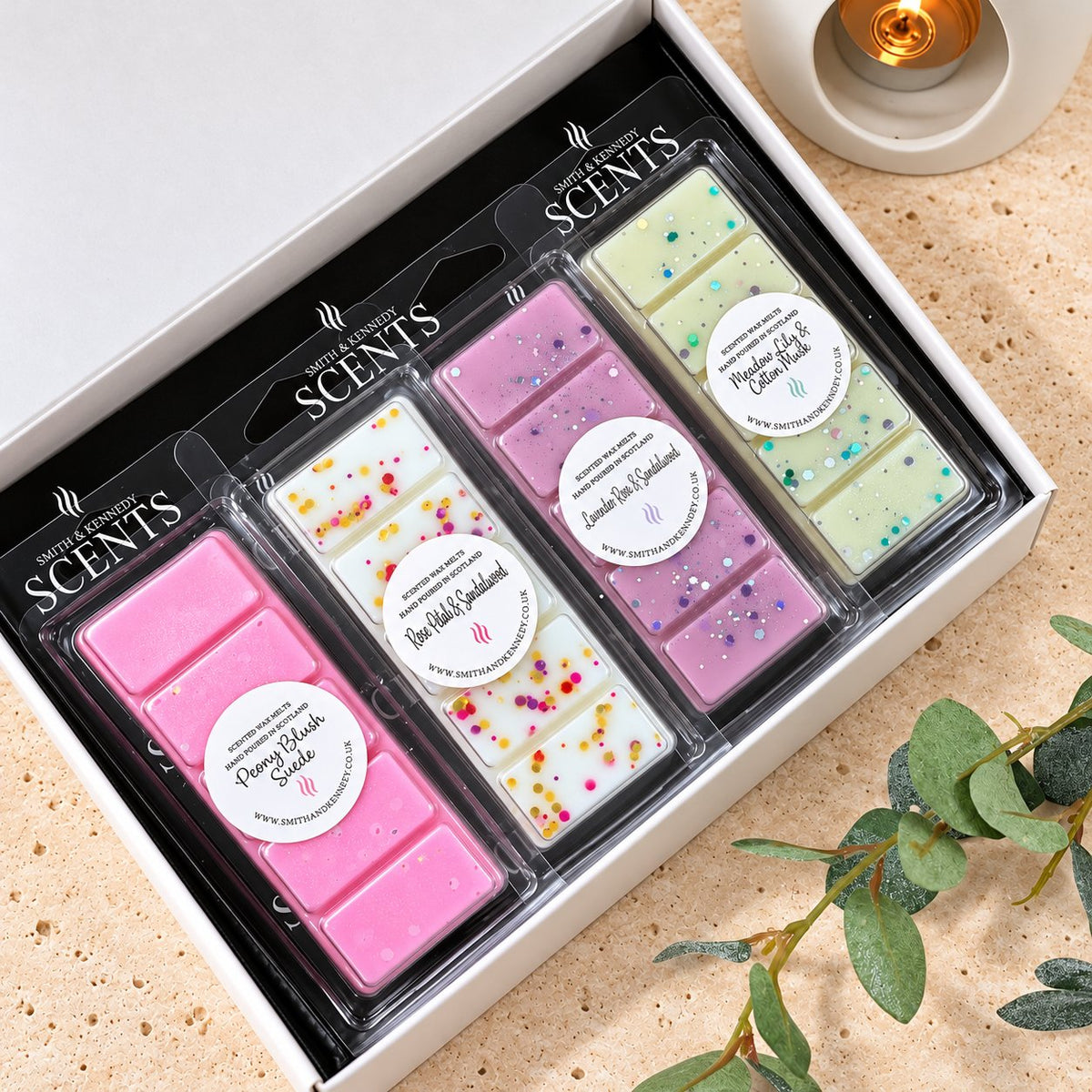 Floral Wax Melt Collection by Smith & Kennedy Scents: Peony Blush Suede, Rose Petal & Sandalwood, Lavender Rose & Sandalwood and Meadow Lily & Cotton Musk snap bars in a white gift box.