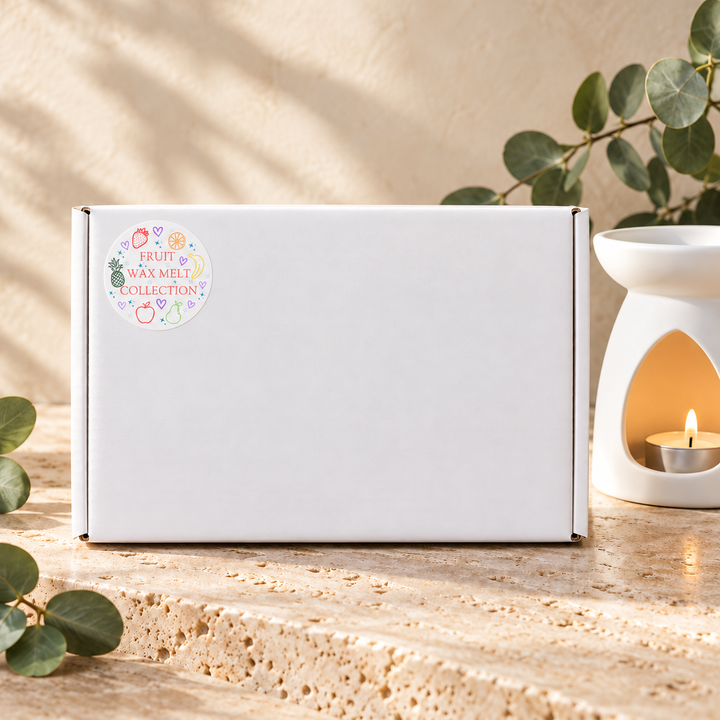 Closed white gift box for the Fruit Wax Melt Collection by Smith &amp; Kennedy Scents, with its matching collection sticker.