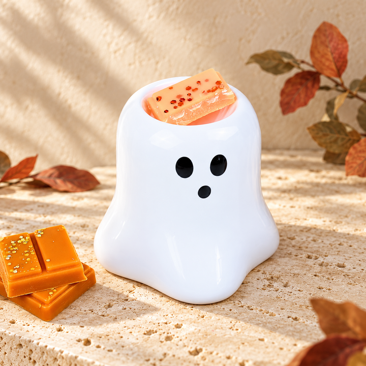 White Boo ghost ceramic wax melt burner with a glittered wax segment in its integrated top well.