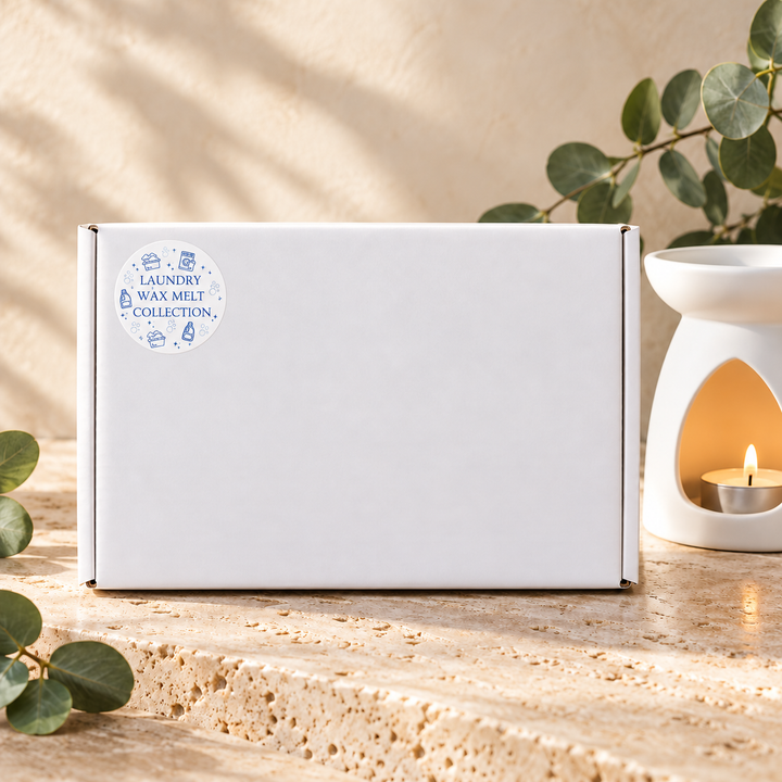 Closed white gift box for the Laundry Wax Melt Collection by Smith &amp; Kennedy Scents, with its matching collection sticker.