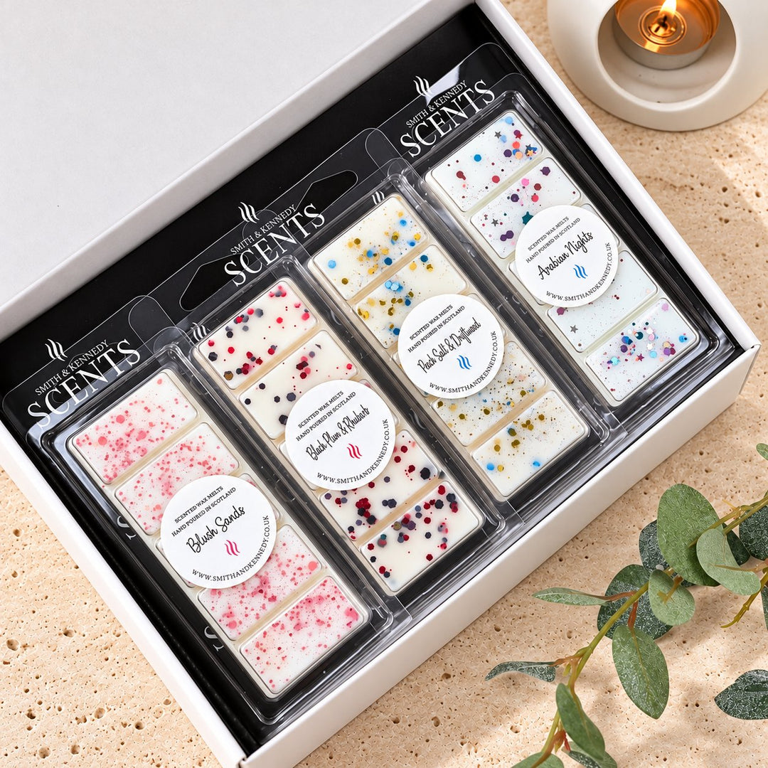 Luxe Wax Melt Collection by Smith &amp; Kennedy Scents: Blush Sands, Black Plum &amp; Rhubarb, Rock Salt &amp; Driftwood and Arabian Nights snap bars in a white gift box.