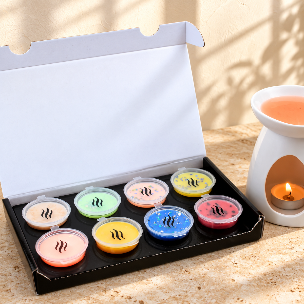 Smith & Kennedy Scents Discovery Box No.2 open with eight colourful wax melt pods beside a white burner