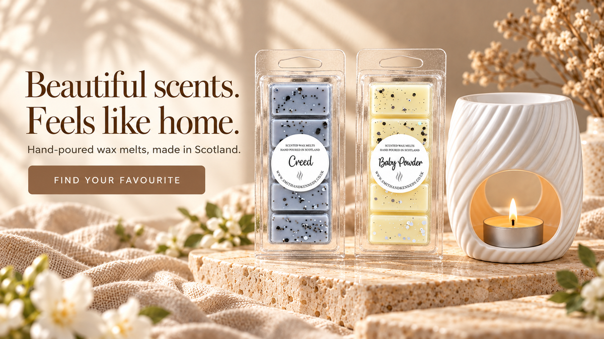 Smith & Kennedy Scents Creed and Baby Powder wax melts with a lit White Wave ceramic burner in a soft daylight setting.