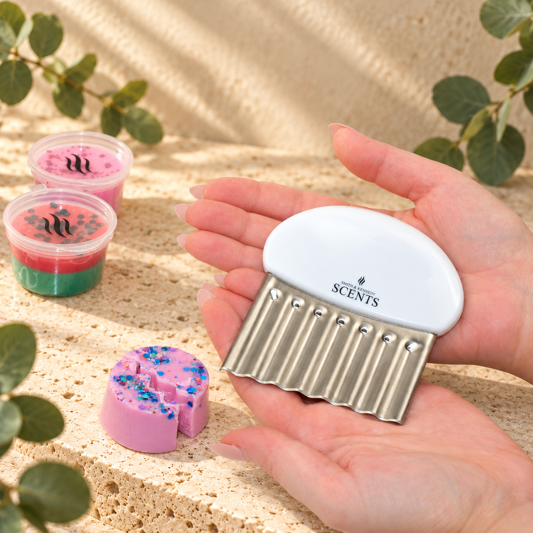 Smith &amp; Kennedy Scents compact wax melt cutter shown in hands to illustrate its size.