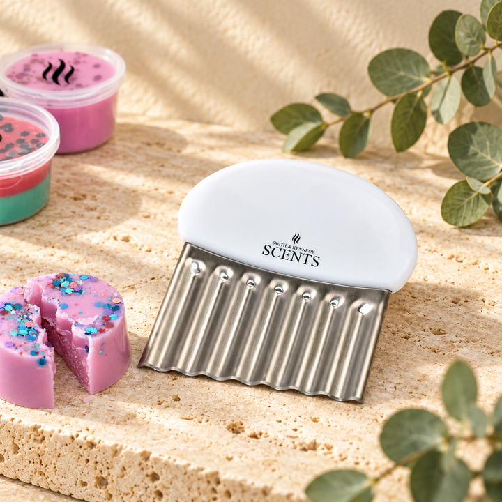 Smith &amp; Kennedy Scents wax melt cutter beside a portioned pink glitter wax pod.