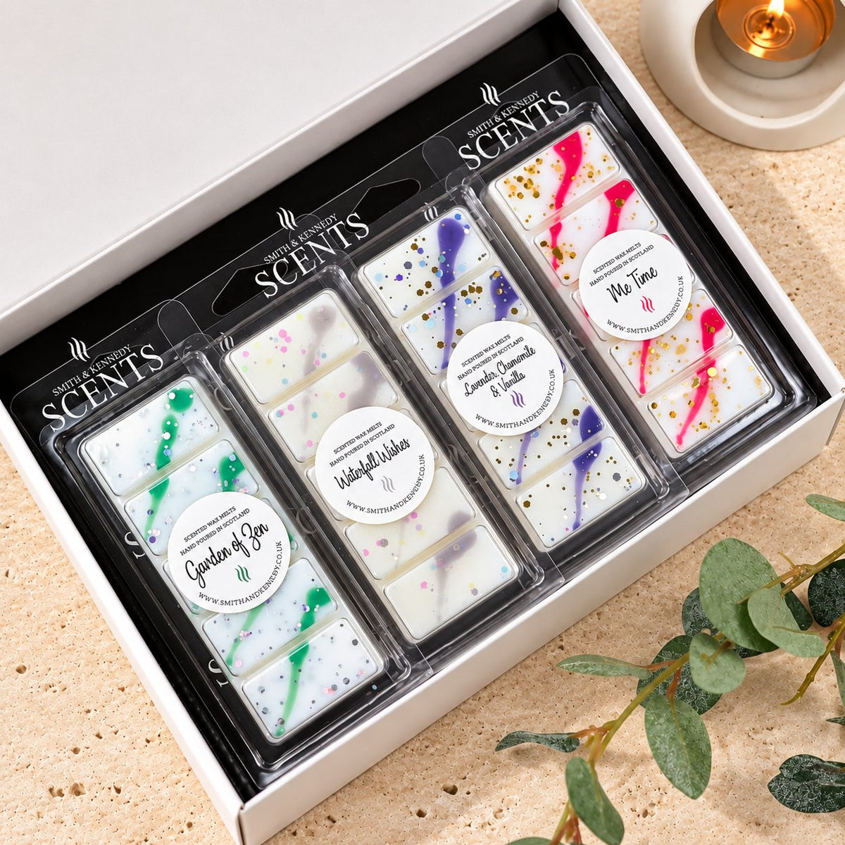 The Spa Day Wax Melt Collection by Smith & Kennedy Scents: Garden Of Zen, Waterfall Wishes, Lavender, Chamomile & Vanilla and Me Time snap bars in a white gift box.