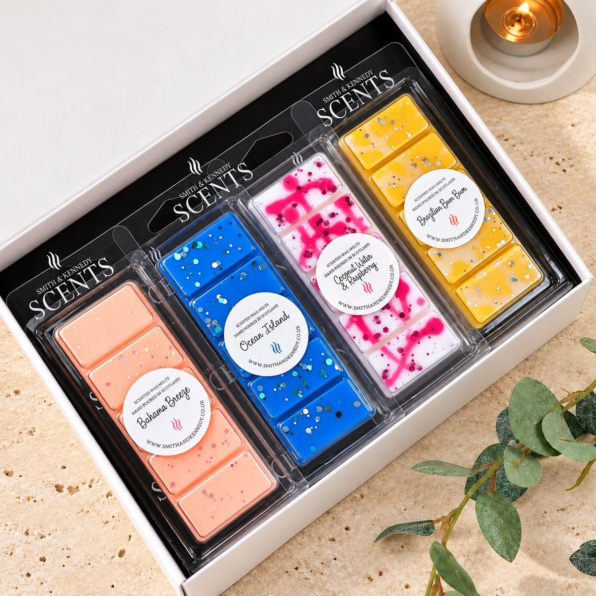 Tropical Wax Melt Collection by Smith & Kennedy Scents: Bahama Breeze, Ocean Island (Seychelles), Coconut Water & Raspberry and Brazilian Bum Bum snap bars in a white gift box.